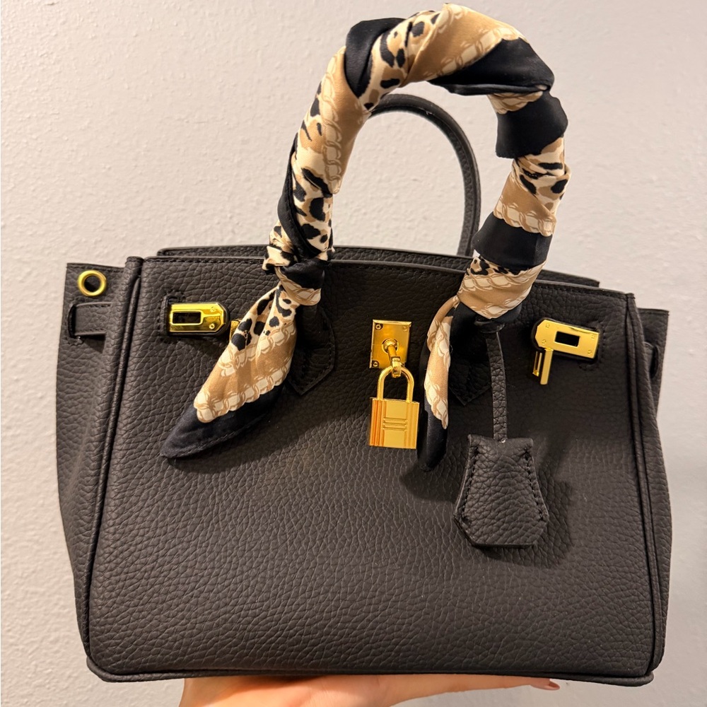 Elegant Black Handbag with Gold Accents Designer Inspo